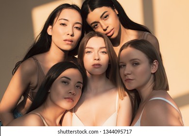 Five Beautiful Multicultural Young Women Looking At Camera In Sunlight 