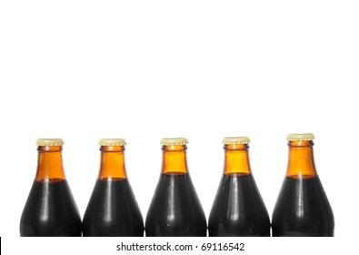 Five Beer Bottles Isolated On A Pure White Background With Blank Copyspace Above With Room For Your Text.