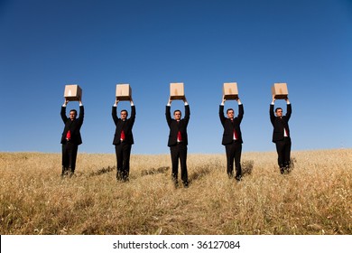 Five Businessman Lineup Holding A Cardboard Box Over His Head