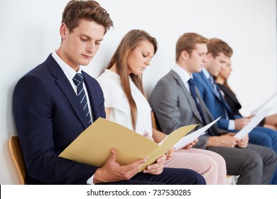 Five candidates waiting for job interviews, close up