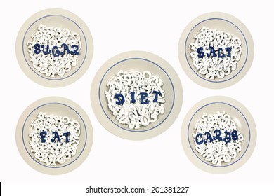 Five cereal bowls filled with white letters with blue letters spelling DIET, SUGAR, FAT, SALT and CARBS