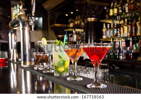 Five cocktails on the bar counter