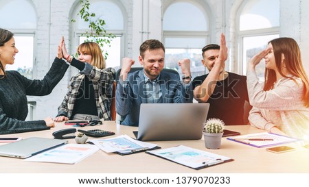 Five colleagues looking happy getting new profitable project, congratulating each other, sharing high five. Success, income, carreer achievements concept.