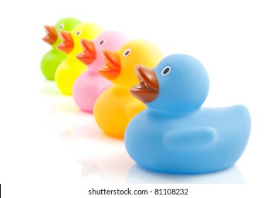 Five Colorful Ducks In A Row Isolated Over White