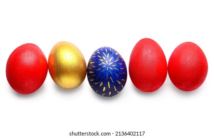 Five colorful easter eggs in a row, one gold, one blue with gold pattern, and three red, isolated on white background