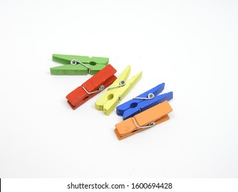 Five colorful paper clips on a white background