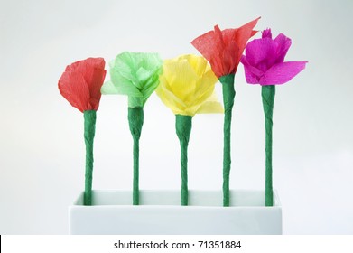 Five Colorful Paper Flowers Made By Child In White Vase