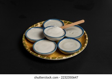 Five cups of candy in a black scene - Powered by Shutterstock