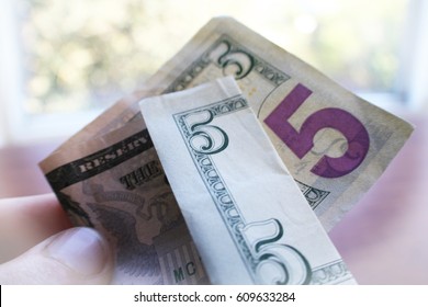 Five Dollar Bill In Hand Close Up 