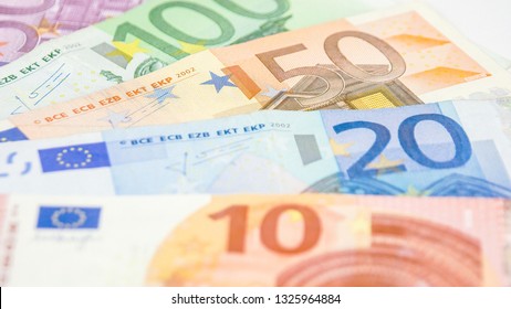 Five Euro bills on the table. Consisting of 500 100 50 20 and 10 Euro bills