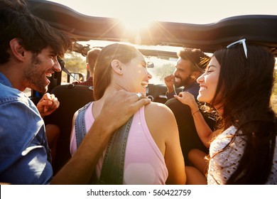 Five Friends Travelling Together On A Road Trip In A Car