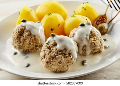 Five Golden Potatoes And Trio Of Meatballs Served In Single Dish With Creamy Caper Sauce. In German It Called Königsberger Klopse.