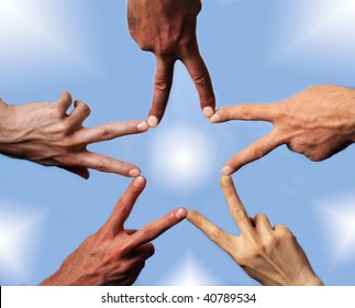 Five hands with different skin-color, their fingers building a star