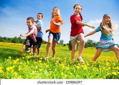 Five Happy Diversity Looking Children Running In The Park