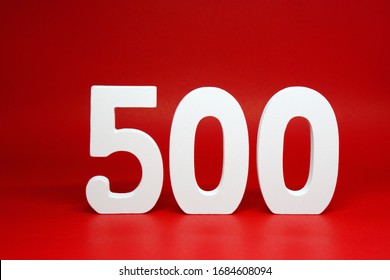 Five Hundred ( 500 ) white wooden number Isolated Red Background with Copy Space - New promotion 500% Percentage  Business finance Concept