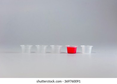 Five ink plastic caps, one with red color