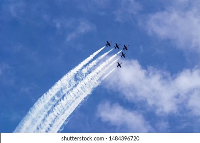 Five jet combat training aircraft in the sky.