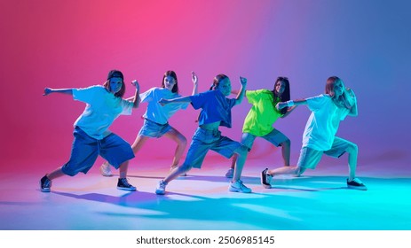 Five kids strike dynamic hip hop poses with intense focus and style against gradient pink purple background in neon light. Concept of modern dance styles, youth culture, active lifestyle - Powered by Shutterstock