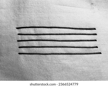 Five lines stitched on to a cloth.