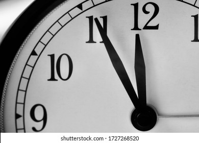 Five Minutes To Twelve On The Alarm Clock