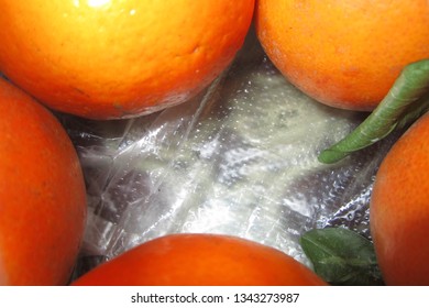 Five oranges and two leaves
