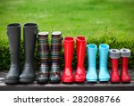 Five pairs of a colorful rain boots. Family concept