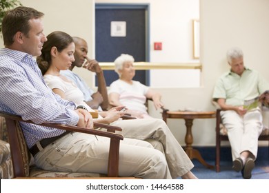 Five people waiting in waiting room