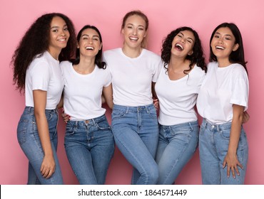 Five Positive Millennials Ladies Posing Together Hugging And Smiling To Camera Standing Over Pink Background In Studio, Wearing Casual Clothes. Multiethnic Female Beauty Concept - Powered by Shutterstock