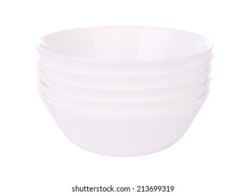 Five round ceramic bowls stack on white background.