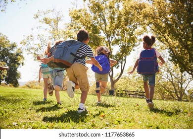 Five School Kids Running In A Field, Back View, Close Up