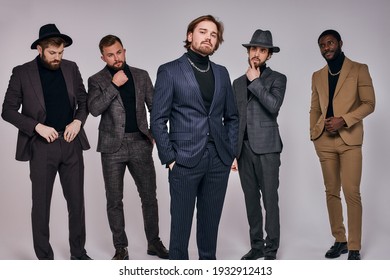 Five Serious Gangsters Stand In A Row In Studio. Retro. Indoors. Young Guys In Elegant Fashionable Fancy Suit Or Tuxedo Posing At Camera, Copy Space