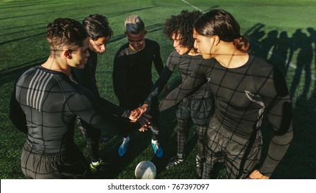 Five A Side Football Team Putting Their Hands Together. Soccer Players With Stack Of Hands.