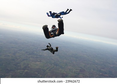 Five skydivers in freefall