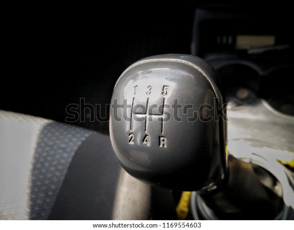 Five\
speed gear shift in car . Gear\
transmission.\
\
