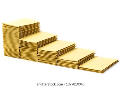 Five stacks of padded mailing envelopes arranged in ascending order to form stairs. - Shutterstock ID 1897819345