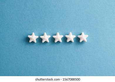 Five Star Rating Feedback. Stars On Blue Background