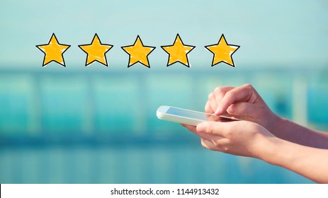 Five Star Rating with person holding a white smartphone