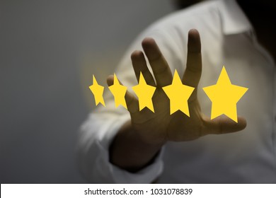 Five stars (5) rating with a businessman touching screen, concept about positive customer feedback and review, excellent performance