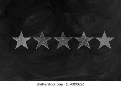 five stars drawn in chalk on a chalk board. service and service assessment concept