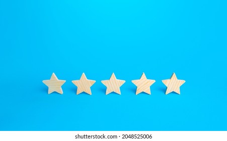 Five stars on a blue background. Rating evaluation concept. High satisfaction. Good reputation. Popularity rating of restaurants, hotels or mobile applications. Highest score. Service quality feedback