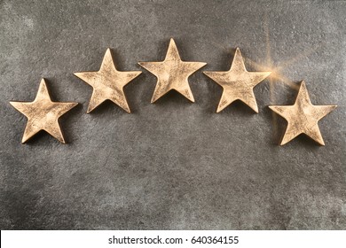 Five stars on dark background