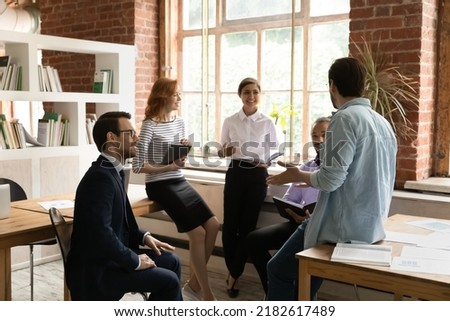 Similar – Image, Stock Photo Young, ambitious coach instructs his players on what to do on the field. Coaching games from behind the line. Mentality and crisis preparedness