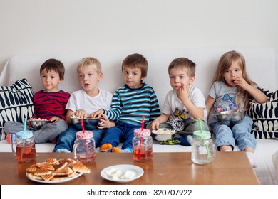 Five Sweet Kids, Friends, Sitting In Living Room At Home, Watching TV And Eating Popcorn