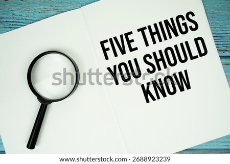 Five Things You Should Know text written on notepad with magnifying glass flat lay on wooden background