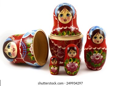 Five Traditional Russian Matryoshka Dolls On White Background