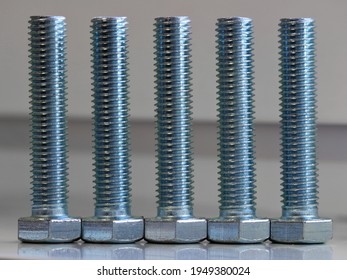 Five Vertically Standing Large Bolts Magazine Cover Background