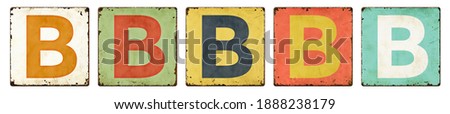 Five vintage tin signs on a white background - Letter B