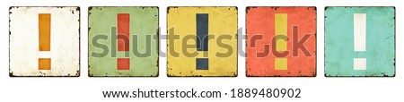 Five vintage tin signs on a white background - Exclamation mark