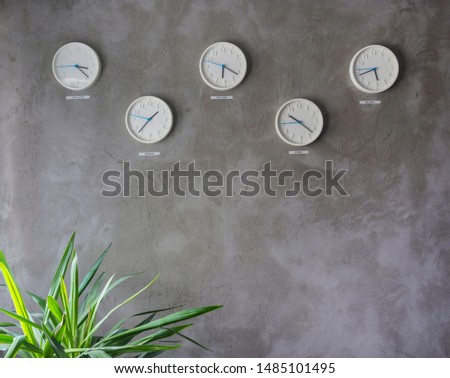 Five wall clocks showing time in different capitals of the world,minimal and modern wall