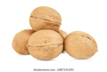 five walnuts with a strong shell are isolated on a white background with shadow and reflection	